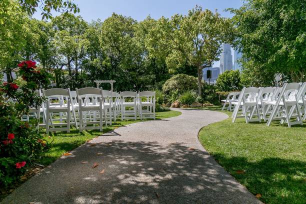 istock a garden with several chairs, bushes and trees in the background 1659504732