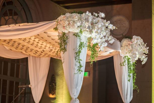 istock a wedding canopy covered in flowers and curtains and draperies 1659504744