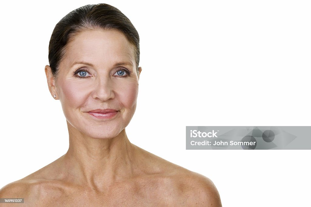 Beautiful mature woman Beautiful mature woman with hair back and isolated on white background  Human Face Stock Photo