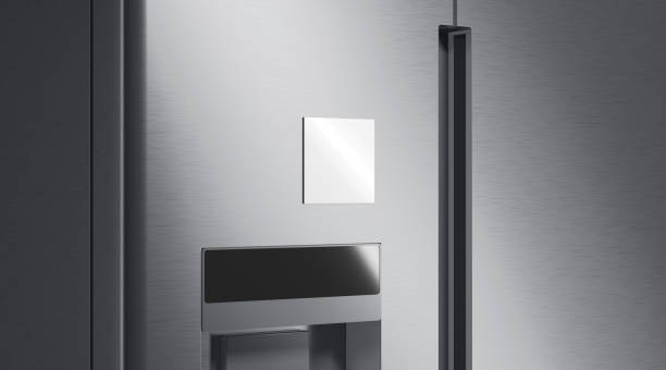 Blank white square magnet on fridge mockup, side view stock photo