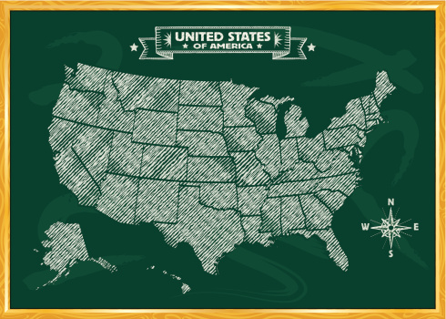 The United States drawn on a chalkboard with banner and compass.