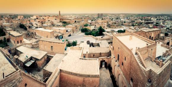 Panoramic view of the city buildings and Mesopotamian plain in light haze