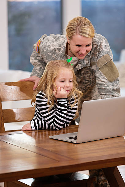 istock Mother and daughter looking at a laptop together 165955978