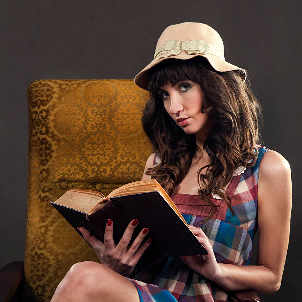 istock Retro woman reading 165956079
