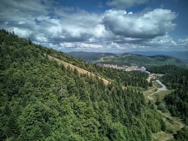 istock Hill side with mountain resort in the background 1659560883