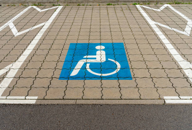 istock Parking lot with signs for wheelchair users 1659562013