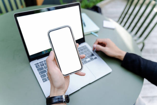 Man hand holding smartphone with mobile app, shopping online, looking at blank display. Mockup