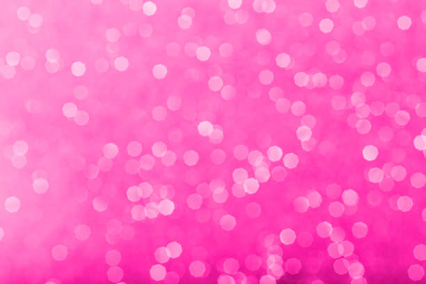 fashion doll pink tones glowing sparkles blurred background