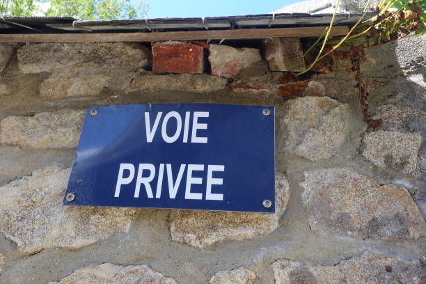 istock Private road  Information sign in French fixed on a wall 1659600131