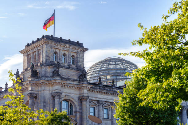 istock German flag on the Reichstag building in Berlin, Germany 1659605086