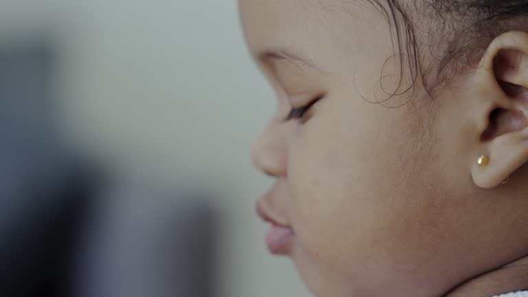 little girl eating grapes