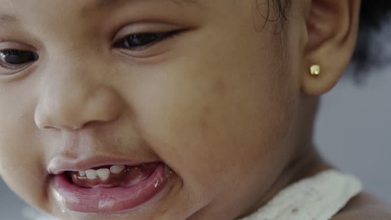 child eating grapes