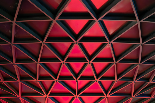 Abstract vortex architectural pattern of red triangles