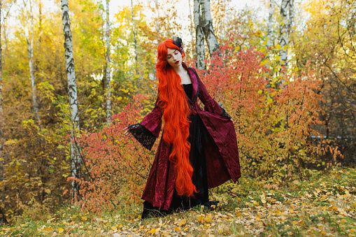 Redhead woman in red gothic dress