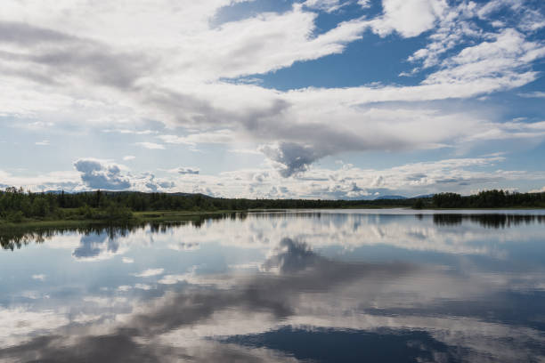 istock Mirror like reflection ona beautiful small lake in Norway 1659688375