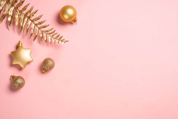 istock Christmas composition with golden christmas decorations at pink background. 1659692816