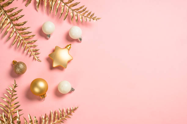 istock Christmas composition with golden christmas decorations at pink background. 1659705102