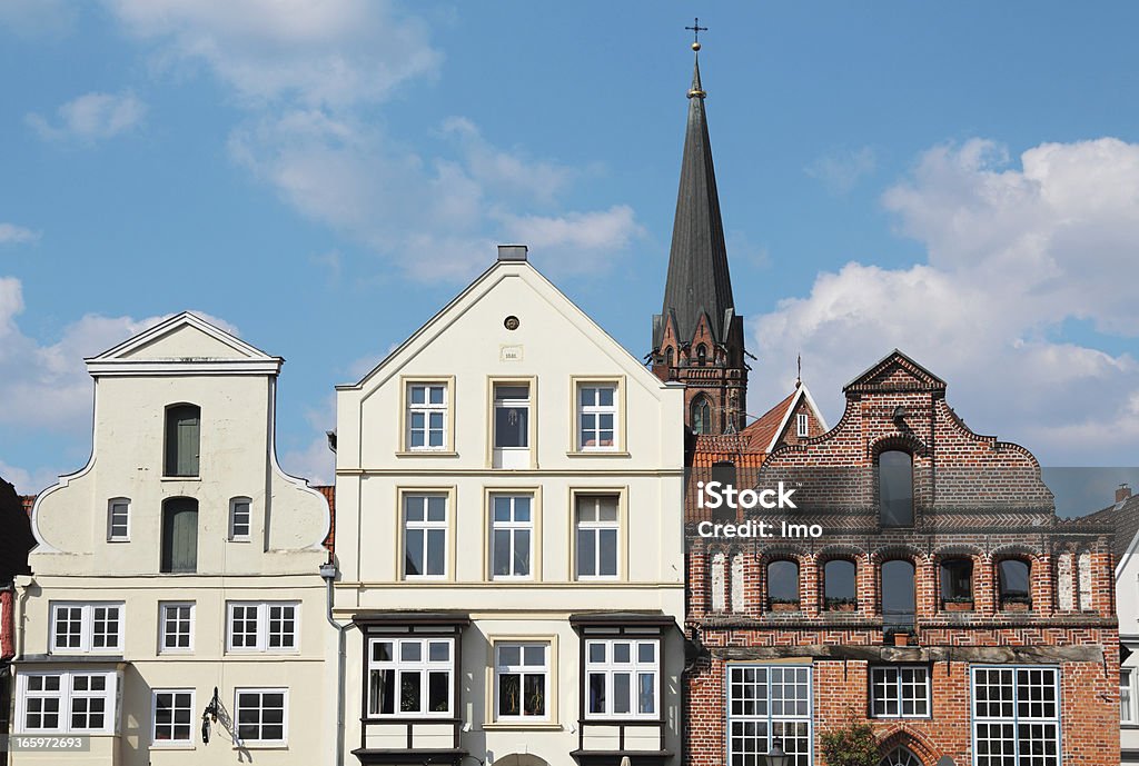 Historic buildings, Lüneburg, Germany Historic buildings in the old part of town of Lüneburg. St. Nicolai-Church in the background. Nothern Germany Lüneburg Stock Photo