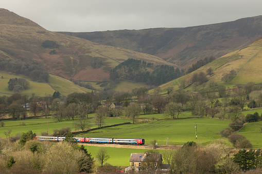 PEAK DISTRICT, UK - March 01, 2023. Passenger train on the Hope Valley railway line, Edale, Derbyshire, UK