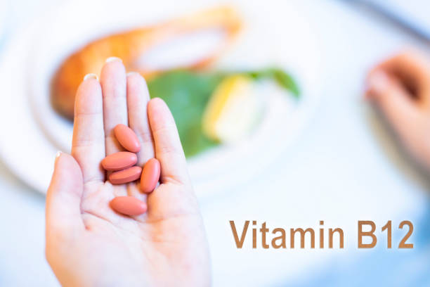 A male nutritionist works at his desk, discussing the benefits of eating fruit. He analyzes diets and educates patients on healthy eating habits for optimal health and well-being
