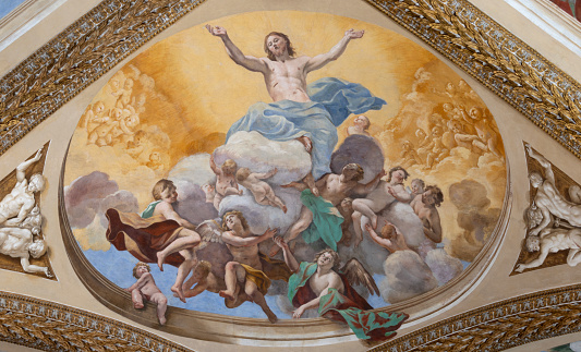 Vienna, Austria - May 26, 2015: Wide angle interior view of the ceiling and interior library space of the Prunksaal, the Austrian National Library, in Vienna, Austria. It is part of the Hofburg Complex.