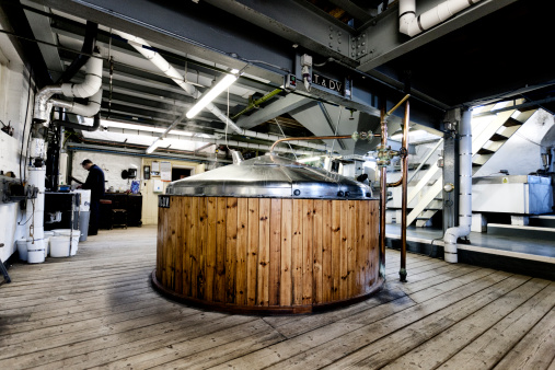 Wooden fermentation vat producing beer in a traditional Dorset brewery, UK