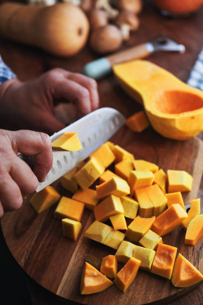 istock Cutting Butternut Pumpkins for Vegan Thanksgiving Dinner 1659768545