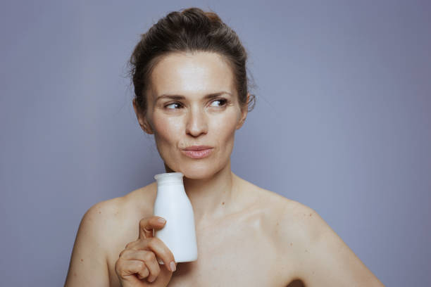 istock pensive young woman with cosmetic cream jar 1659771741