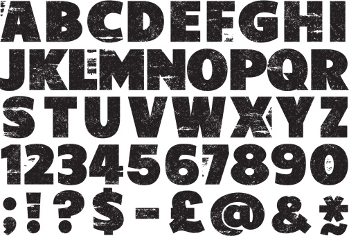 Upper case rubber stamp alphabet set with numbers, punctuation and other characters.