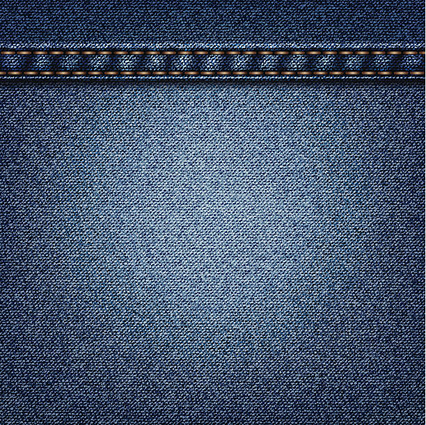 istock A cut of blue colored denim with orange lines sowed in 165977851