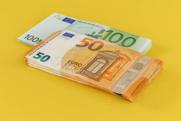 istock Money Euro banknotes scattered on the table 1659811345