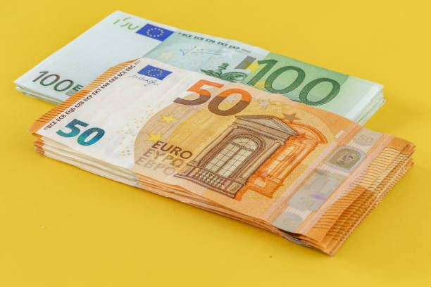 istock Money Euro banknotes scattered on the table 1659811365