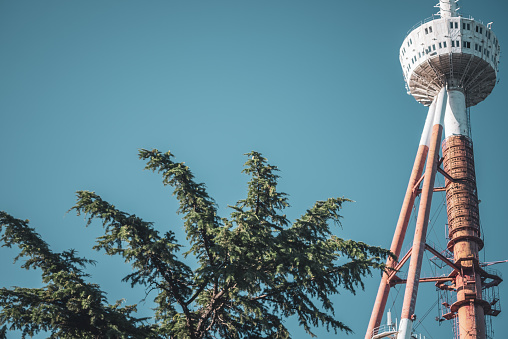 low-angle shot of the Tbilisi TV Broadcasting Tower against blue