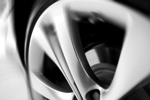 closeup of a motion blurred car wheel