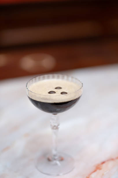 istock Espresso martini above angle, marble bar counter, vertical image 1659843942
