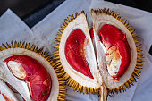 Fruits of Sabah Borneo called Durian Dalit and its flesh is in red color. The Durian Dalit for sell at the street market in Kota Kinabalu, Malaysia, close up