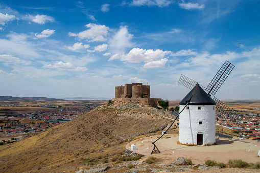 Consuegra, Spain - July 25, 2019: Castle of Consuegra with windmill