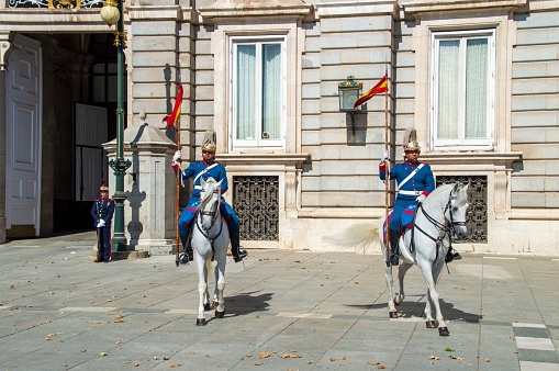 Madrid, Spain - July 27, 2019: Guards in front of the Palacio Real de Madrid (Spanish Royal Palace)