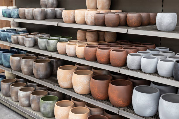 istock Several flower pots in different sizes and colors in a row next to each other. 1659853646