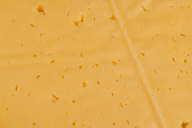 istock semi- hard cheese with holes cut into chunks 1659858467