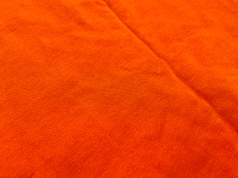 Orange color fabric textile texture background