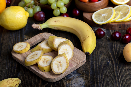 Sliced ripe yellow banana, slices of ripe banana on the kitchen table