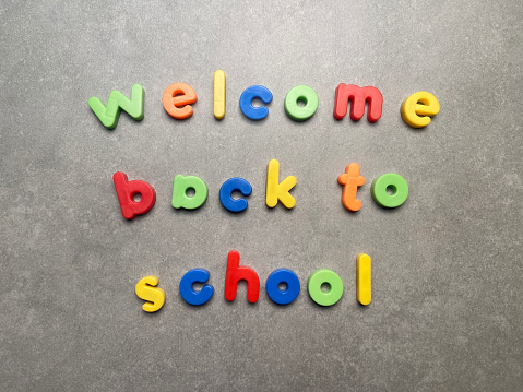 Welcome back to school with multicolored letters