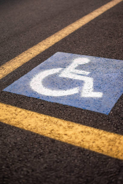 istock Parking sign for disabled on asphalt with yellow lines 1659920943