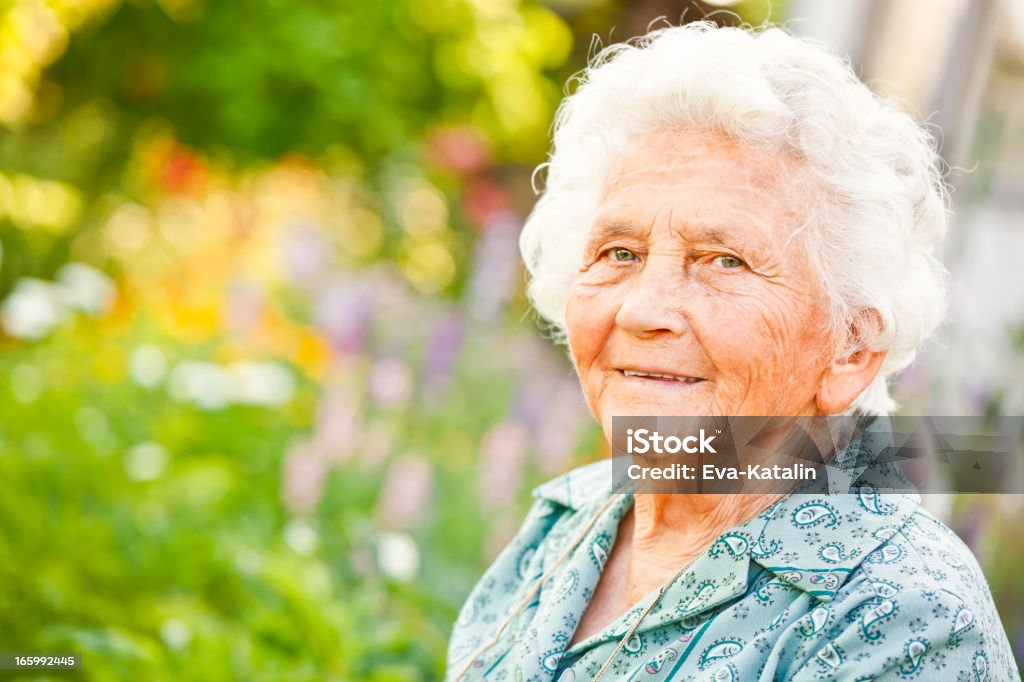 Summer portrait of a lovely grandma Lovely elderly lady relaxing in her garden 80-89 Years Stock Photo Summer portrait of a lovely grandma Lovely elderly lady relaxing in her garden 80-89 Years Stock Photo