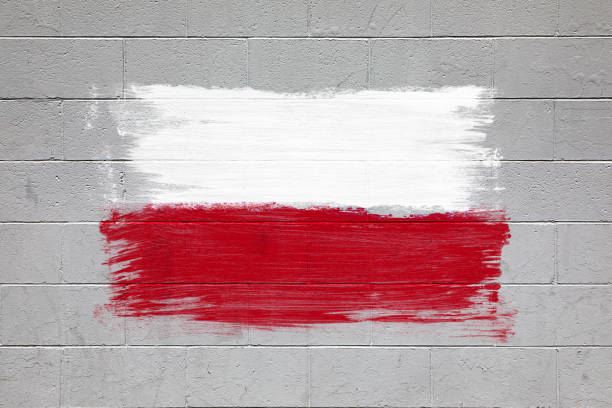 Close up of Poland flag colors red  and white painted on brick wall