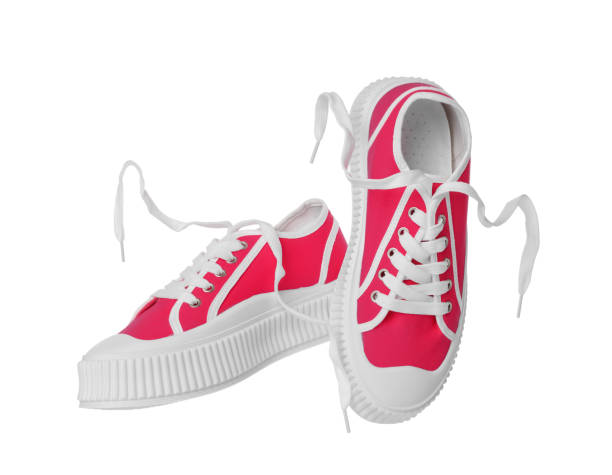 istock Pair of red classic old school sneakers on white background 1659939169