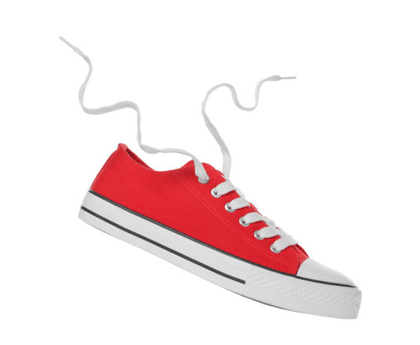 istock Red classic old school sneaker isolated on white 1659939215