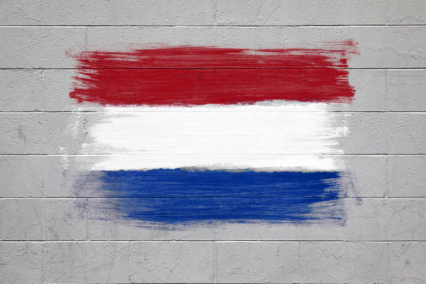 Close up of the Netherlands flag colors red, blue and white painted on brick wall