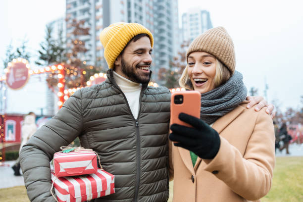 istock Young couple on a Christmas market 1659939940